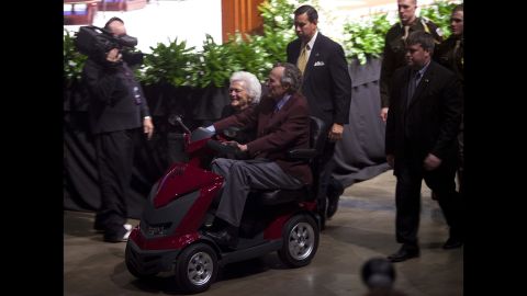 The former President and first lady leave after a panel discussion at an event commemorating the Gulf War on January 20, 2011.