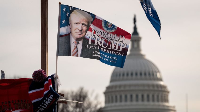 With the U.S. Capitol in the background, a 'Trump' flag flies on top of a merchandise stand on North Capitol Street, January 19, 2017 in Washington. DC. 