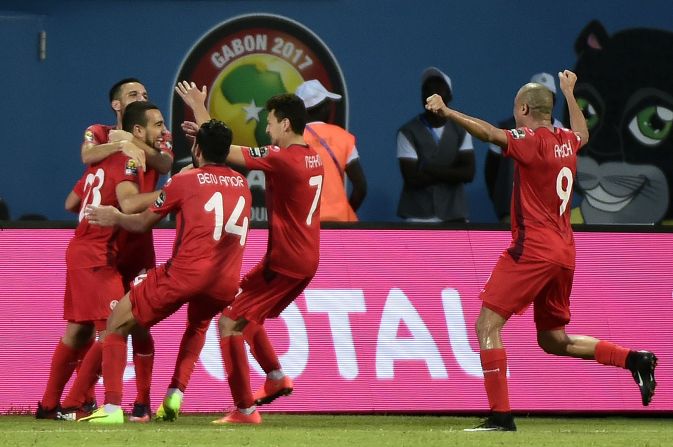 Tunisia's players celebrate after Naïm Sliti's penalty put his side 2-0 up in a crucial Group B clash against Algeria.