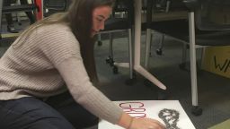 Jilly Horowitz prepares signs for Saturday's Women's March on Washington.