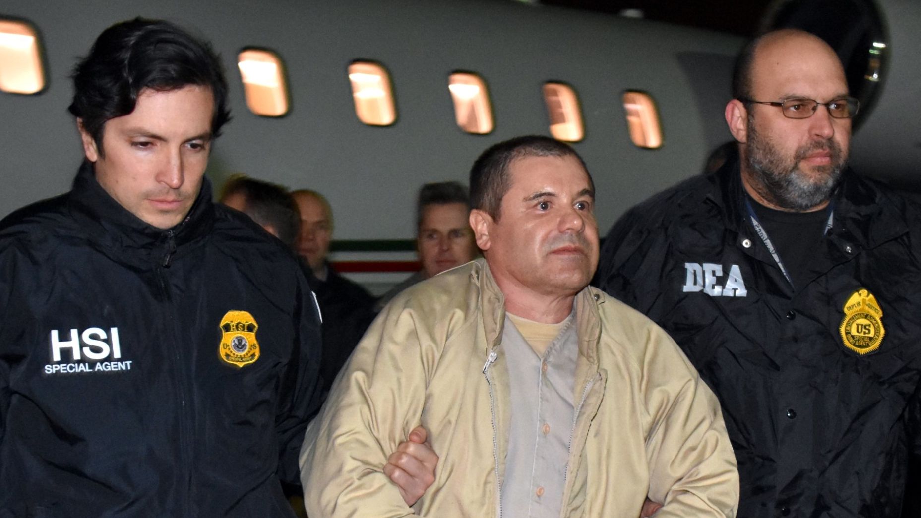 US authorities escort Joaquin "El Chapo" Guzman on Thursday at a Long Island, New York, airport.