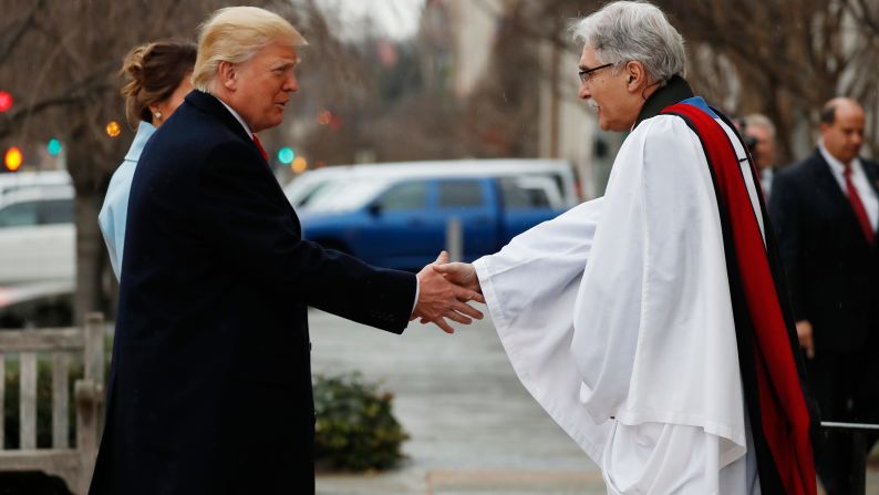 The Rev. Luis Leon greets the Trumps on their arrival for the service at St. John's.