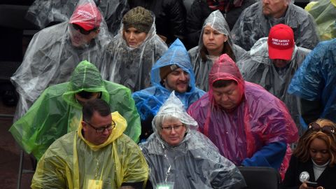 The rain doesn't deter a crowd from gathering to watch the inauguration ceremony.