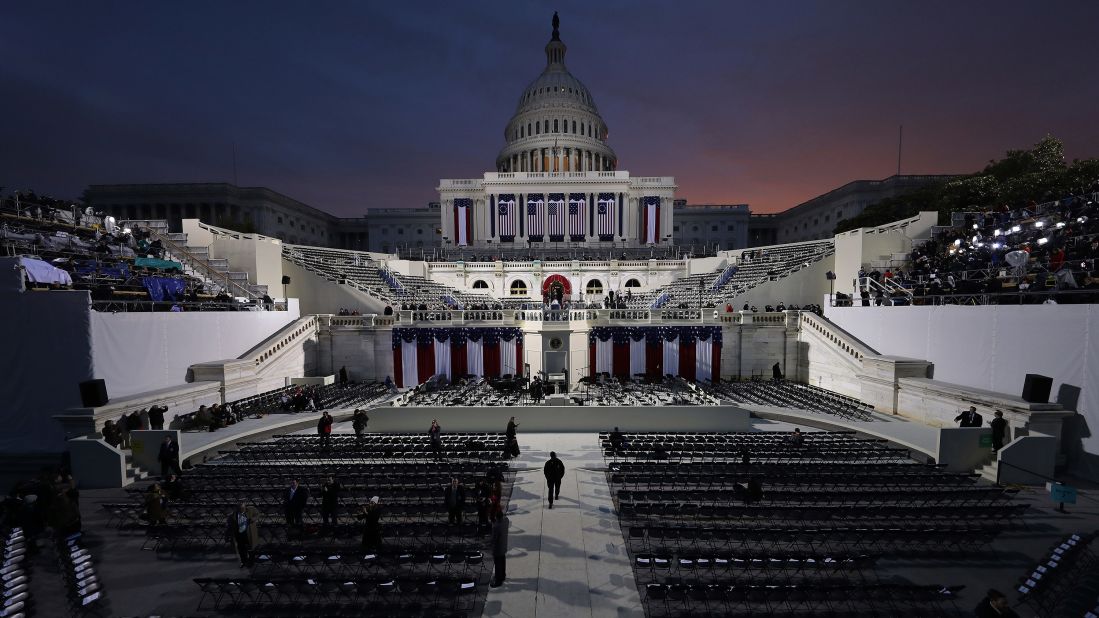 The sun begins to rise behind the Capitol as Washington prepares for Donald Trump's inauguration.