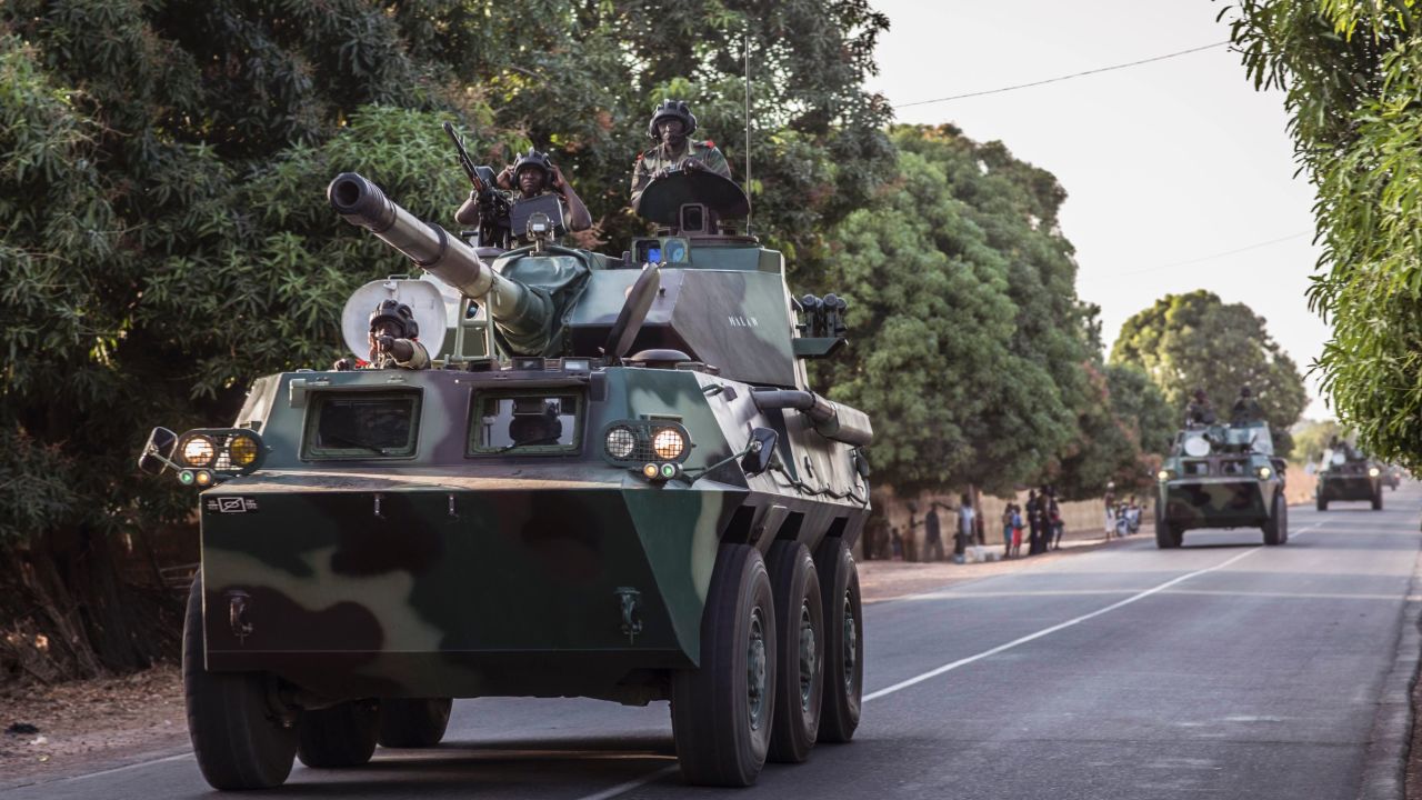 A convoy of Senegalese soldiers head toward Gambia's border Thursday.