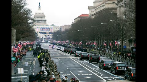 The presidential motorcade moves down Pennsylvania Avenue to the Capitol for the inauguration ceremony.