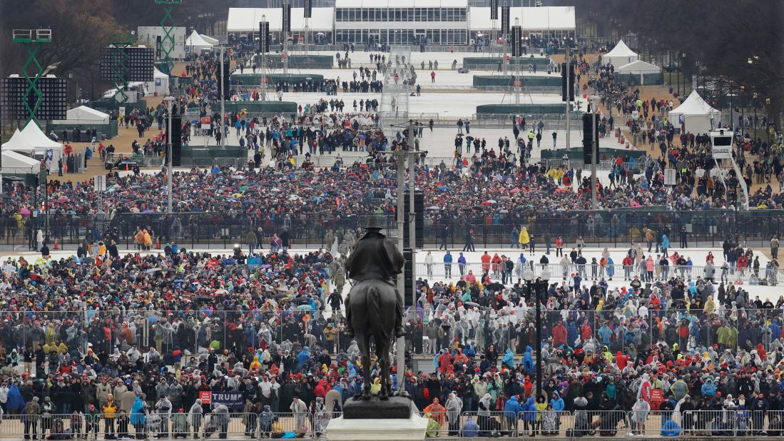 Crowds file in along the National Mall before Trump's swearing-in.