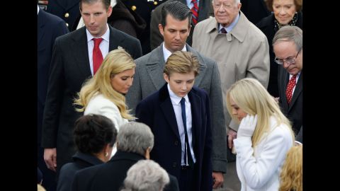 Trump's children look for their seats before the ceremony begins.