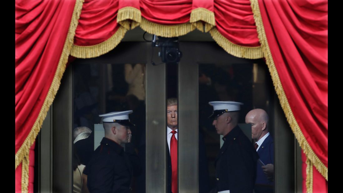 Trump waits to step out onto the portico for his presidential inauguration.