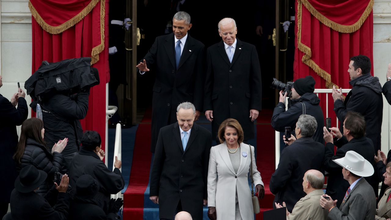 Obama and Vice President Joe Biden arrive on the West Front of the Capitol. Senate Minority Leader Chuck Schumer and House Minority Leader Nancy Pelosi step before them.