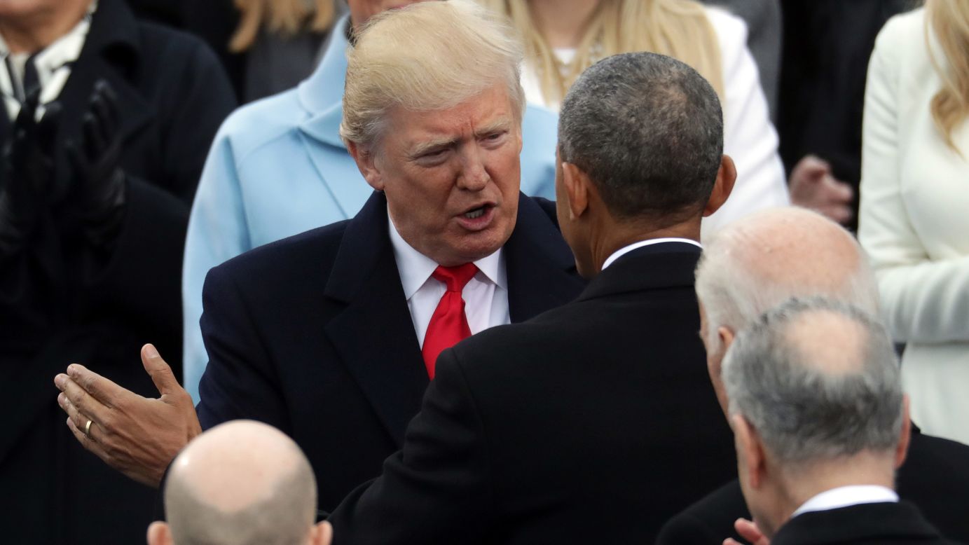 President Barack Obama chats with Trump before the ceremony.