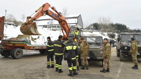 Italian rescuers prepare to join the operation near the village of Penne on Friday.