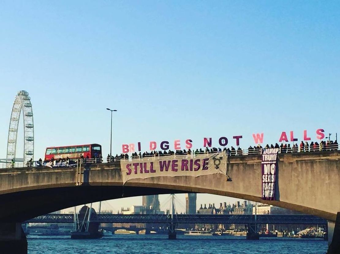 Protesters hold letters spelling out "Bridges Not Walls" on London's Waterloo Bridge on Friday morning.