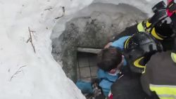This frame from video shows Italian firefighters extracting a boy alive from under snow and debris of an hotel that was hit by an avalanche on Wednesday, in Rigopiano, central Italy, Friday, Jan. 20, 2017. (Italian Firefighters/ANSA via AP)