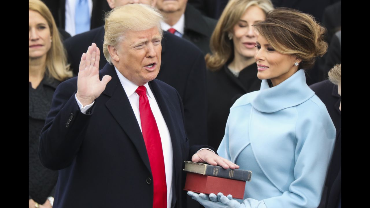 Donald Trump is <a href="http://www.cnn.com/2017/01/20/politics/donald-trump-inauguration-highlights/" target="_blank">sworn in as the 45th President of the United States</a> as his wife, Melania, looks on during the inauguration ceremony in Washington on Friday, January 20. He used a family bible and one that belonged to Abraham Lincoln.