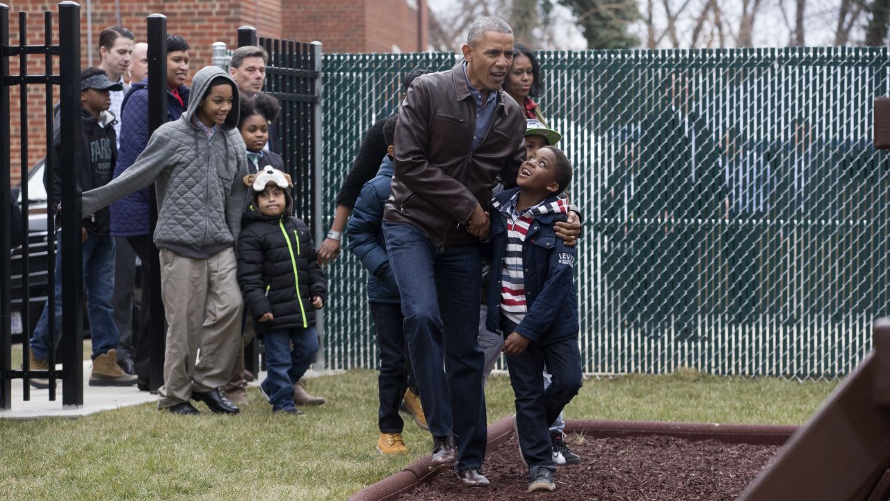 Then-President Barack Obama and his wife, Michelle, walk with a group of children at the "Jobs Have Priority" Naylor Road Family Shelter in Washington on Monday, January 16 -- Martin Luther King Jr. Day. <a href="http://www.cnn.com/2017/01/16/politics/barack-obama-michelle-obama-swing-set-washington-dc/" target="_blank">The Obamas donated a swingset</a> formerly used by their two daughters, Sasha and Malia, to the DC shelter.
