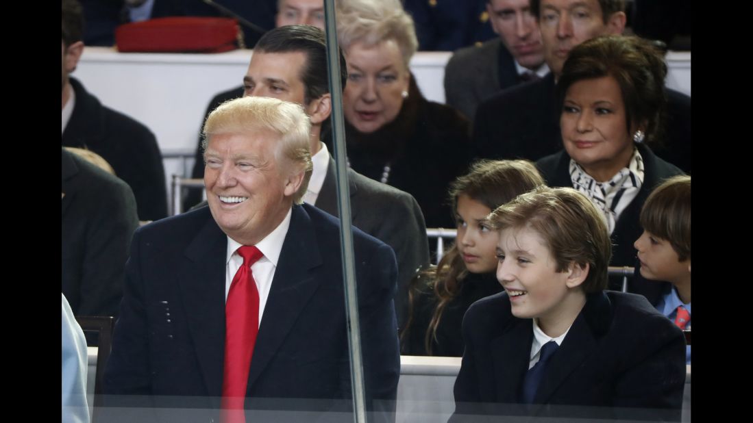 President Donald Trump smiles with his son Barron as they watch the 58th Presidential Inaugural Parade in Washington on Friday, January 20.