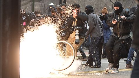 A police flash-bang grenade explodes as they clash with protesters after the inauguration of US President Donald Trump on January 20, 2017 in Washington, DC. 