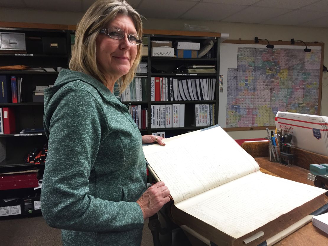Christee Haney, the Grant County clerk and more, writes in the same logs used in the late 1800s. 