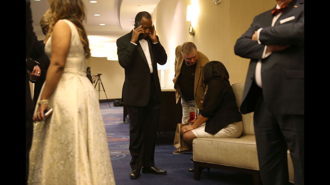 Ben Carson, President Donald Trump's pick to lead the Department of Housing and Urban Development, speaks on his cell phone during the Traditional Values Coalition's Christian Inaugural Gala in Washington on Thursday, January 19. 