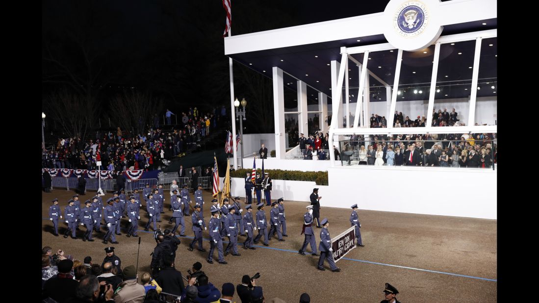 President Donald Trump salutes members of the New York Military Academy during the 58th Presidential Inaugural Parade on Friday, January 20.