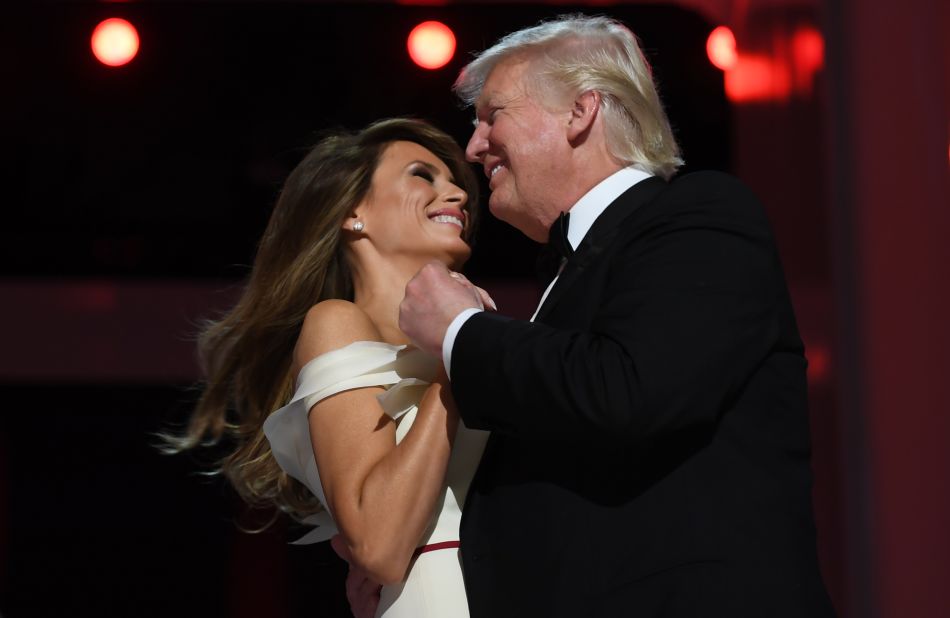 The first lady dances with her husband at an inaugural ball.