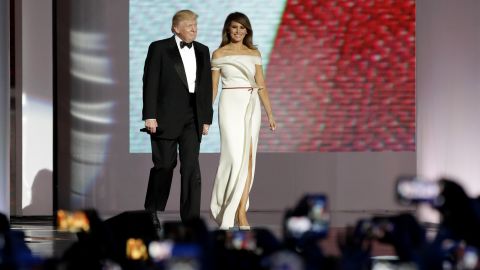 President Donald Trump, left, arrives with first lady Melania Trump at the Liberty Ball, Friday, Jan. 20, 2017, in Washington. 