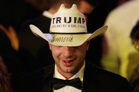  A guest wears a cowboy hat emblazoned with President Trump's campaign slogan during the Freedom Inaugural Ball.