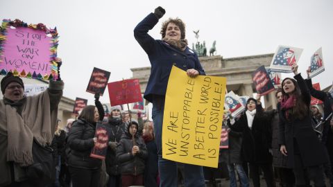 Protesters rally in front of the Brandenburg Gate in Berlin.