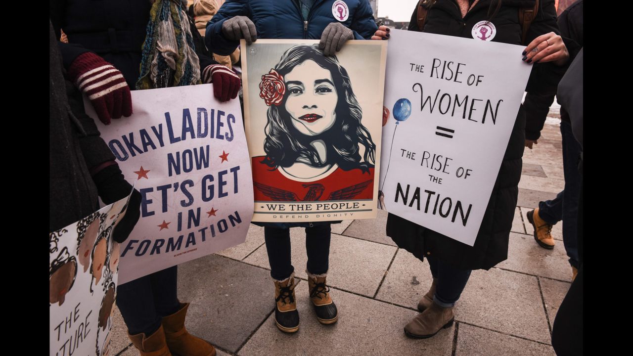 Women's rights activists take part in a march in Pristina, Kosovo.