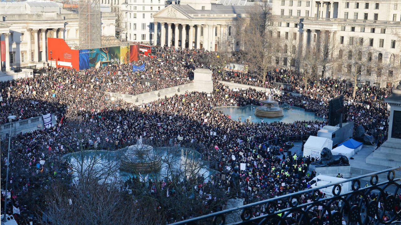 Protesters listen to speeches in London's Trafalgar Square after taking part in a march to promote women's rights.
