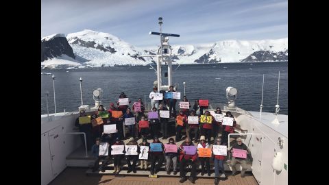 Supporters in the Antarctic Peninsula take part in a women's march on Saturday, January 21. According to organizers, the march includes about 30 people who are eco-minded tourists and non-government scientists. Some held signs saying,  "Penguins for Peace" and "Seals for Science."