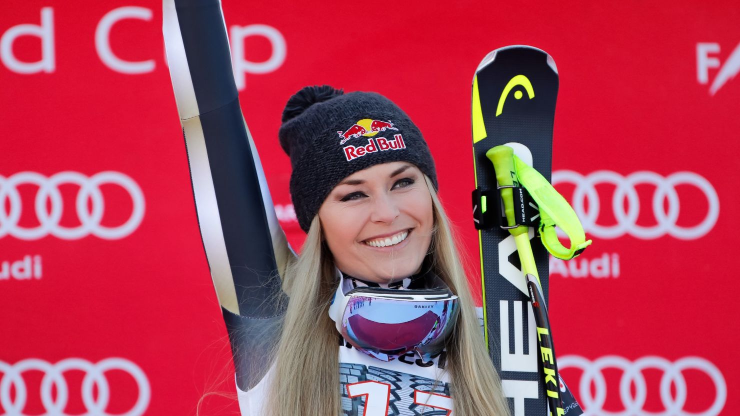 Lindsey Vonn celebrates on the podium after winning the FIS Alpine Ski World Cup Downhill in Garmisch-Partenkirchen.
