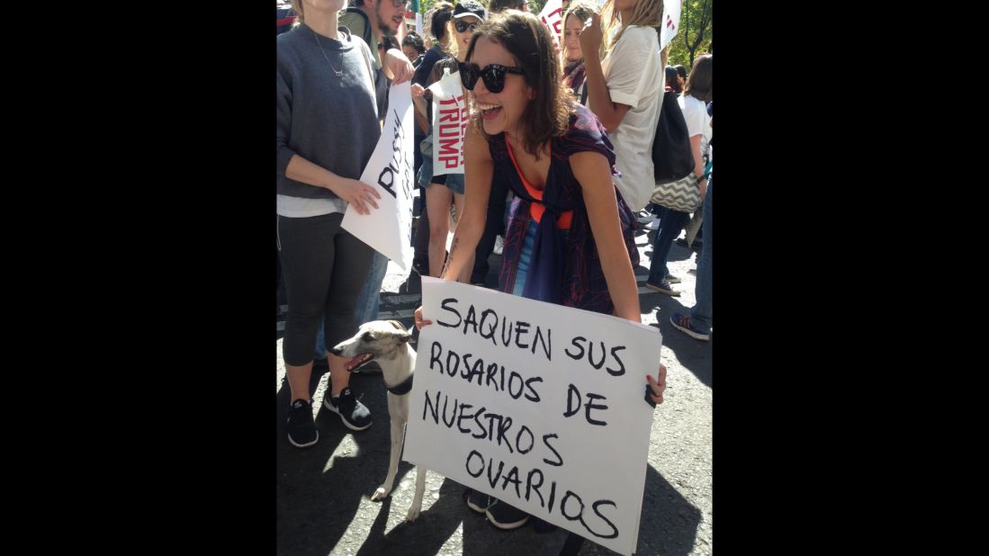 The march in Mexico City drew both Mexicans and Americans, with protesters holding signs in English and Spanish.