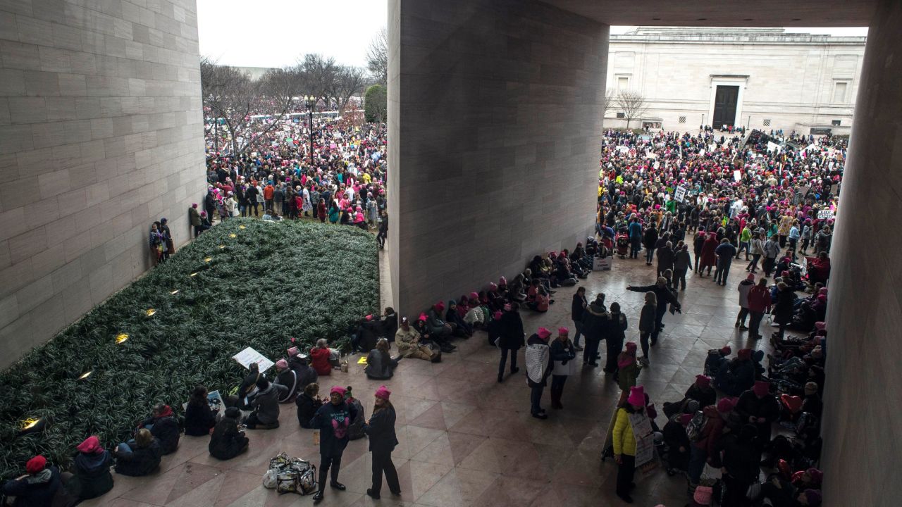 Demonstrators take a break from marching at the National Gallery of Art.