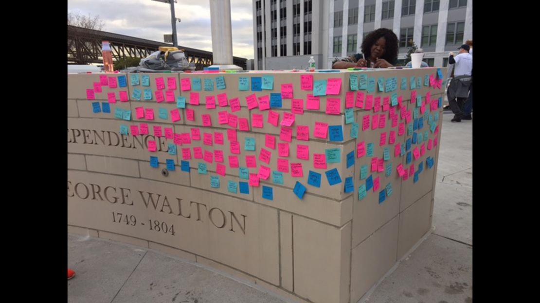 The "wall of solutions," covered in sticky notes.