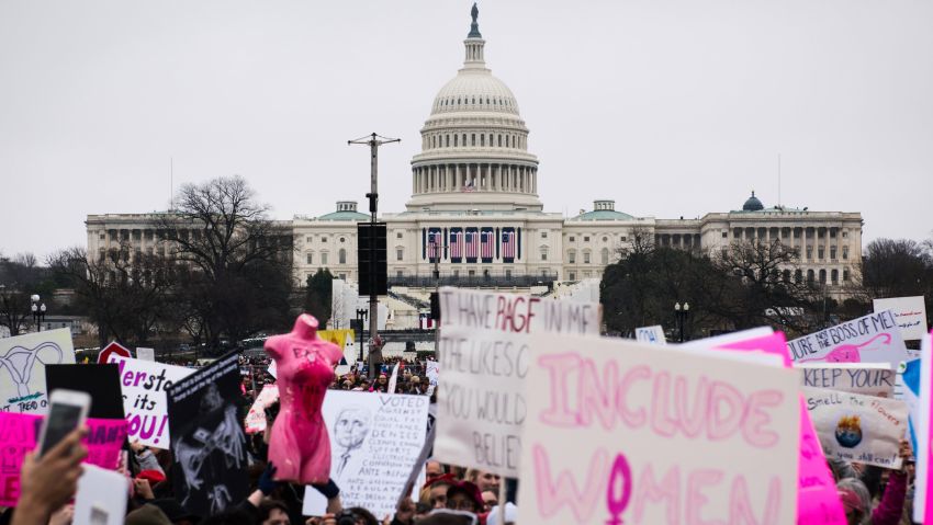 People carry signs on the National Mall during the Women's March on Washington in Washington, D.C., on January 21, 2017. Credit: Mark Kauzlarich for CNN