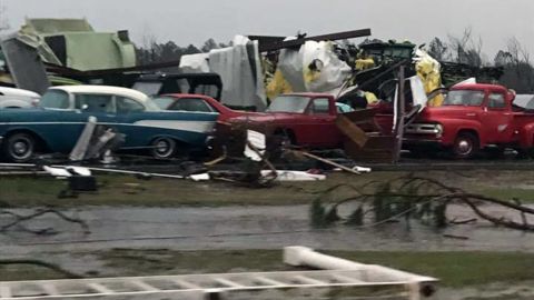 Vehicles, trees and other debris litter the roadway in south Georgia.