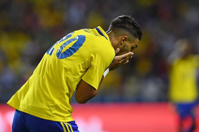 Gabon's forward Denis Bouanga reacts after missing an early chance against Cameroon as the host made an early exit from the tournament.