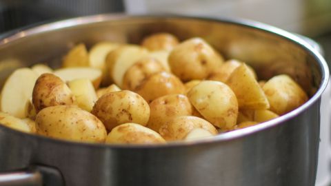 Boiled potatoes do not produce acrylamide as temperatures do not reach more than 100 degrees when boiling water. This is why they remain white in color.