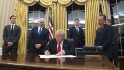 WASHINGTON, DC - JANUARY 20: President Donald Trump prepares to sign a confirmation for Homeland Security Secretary James Kelly, in the Oval Office at the White House in Washington, D.C. on January 20, 2017.  (Photo by Kevin Dietsch - Pool/Getty Images)