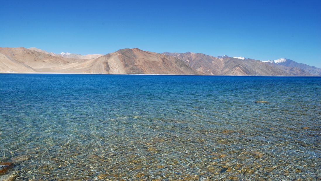 <strong>Pangong Tso, Ladakh: </strong>It's not easy to visit Pangong Tso -- it's a rough five-hour drive from Leh and a permit is required. But the breathtaking views of the blue lake sitting at the base of the Himalayas make the journey worthwhile. The lake, spanning 134 kilometers and sitting at a height of 4,350 meters, is a natural border between China and India. <a href="https://www.cnn.com/2016/05/03/hotels/india-himalayan-hideaways/index.html" target="_blank">MORE: India's best Himalayan escapes</a>