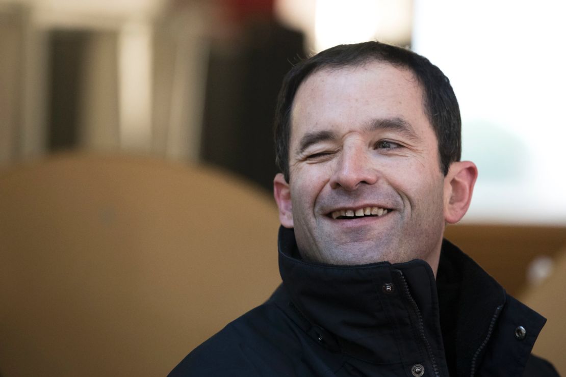 Former Education MInister Benoit Hamon, winks as he arrives for the first round of the French left's presidential primaries in Trappes, west of Paris on January 22, 2017. 