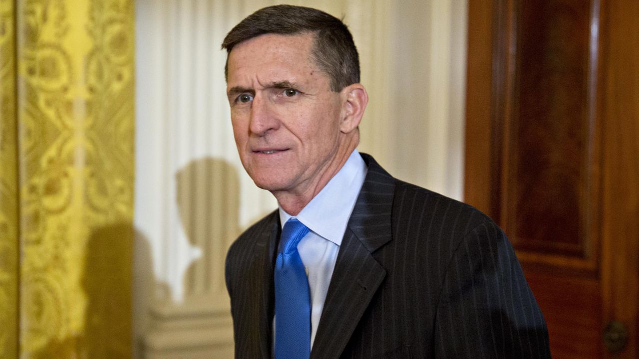 WASHINGTON, DC - JANUARY 22: Retired Lieutenant General Michael Flynn, U.S. national security advisor, arrives to a swearing in ceremony of White House senior staff in the East Room of the White House on January 22, 2017 in Washington, DC. Trump today mocked protesters who gathered for large demonstrations across the U.S. and the world on Saturday to signal discontent with his leadership, but later offered a more conciliatory tone, saying he recognized such marches as a "hallmark of our democracy." (Photo by Andrew Harrer-Pool/Getty Images)