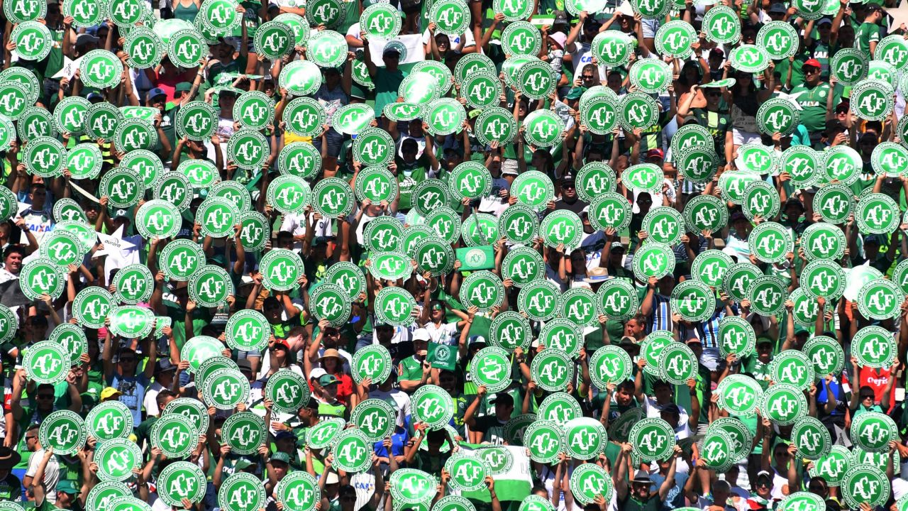 Chapecoense's supporters cheer before a friendly football match against Palmeiras -Brazilian Champion 2016- at the Arena Conda stadium in Chapeco, Santa Catarina state, in southern Brazil on January 21, 2017. 
Most of the members of the Chapocoense football team perished in a November 28, 2016 plane crash in Colombia. / AFP / NELSON ALMEIDA        (Photo credit should read NELSON ALMEIDA/AFP/Getty Images)