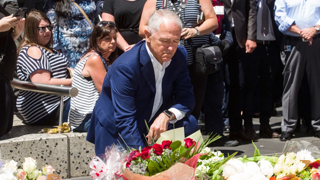 Australian Prime Minister Malcolm Turnbull pays his respects to the victims of Friday's crash.