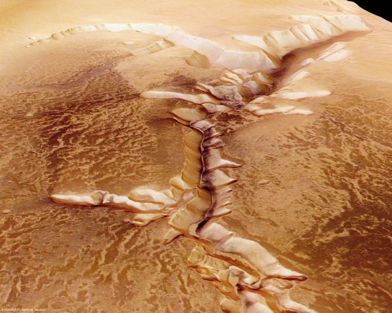 The European Space Agency (ESA) captures the Echus Chasma, one of the largest water source regions on Mars from ESA's Mars Express. It is still debated whether the valleys originate from precipitation, groundwater springs or liquid or magma flows on the surface. 