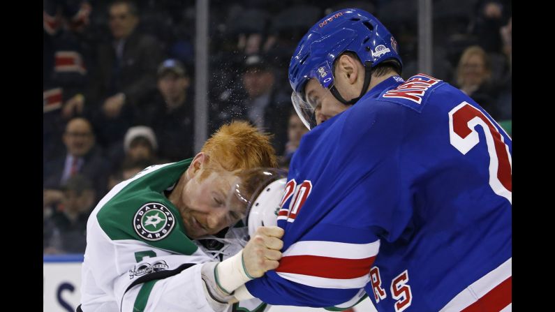 Dallas' Cody Eakin, left, fights Chris Kreider of the New York Rangers during an NHL hockey game in New York on Tuesday, January 17. Kreider <a href="index.php?page=&url=http%3A%2F%2Fwww.espn.com%2Fnhl%2Fstory%2F_%2Fid%2F18502009%2Fnew-york-rangers-chris-kreider-fined-5k-hitting-cody-eakin-helmet" target="_blank" target="_blank">was later fined $5,000</a> for ripping off Eakin's helmet and beating him in the head with it. Earlier this season, Eakin had run into Rangers goalie Henrik Lundqvist, earning a four-game suspension. 
