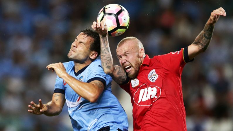 Sydney FC striker Bobo, left, competes for a header with Adelaide United defender Taylor Regan on Friday, January 20.