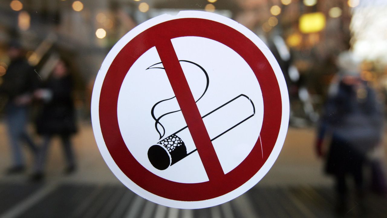 A sticker with a no smoking sign adorns the glass door of a Berlin shopping mall 31 January 2008. Germany, France and Portugal joined many of their neighbours with anti-smoking bans in bars, restaurants and cafes from 01 January 2008, lifting the grey haze that was part of their romantic atmosphere for more than a century. Europe started 2008 with a raft of new laws against smoking, air pollution and even junk food adverts, but some grumbled that the New Year's resolutions from the "nanny state" cramped their style.     AFP PHOTO JOHN MACDOUGALL (Photo credit should read JOHN MACDOUGALL/AFP/Getty Images)